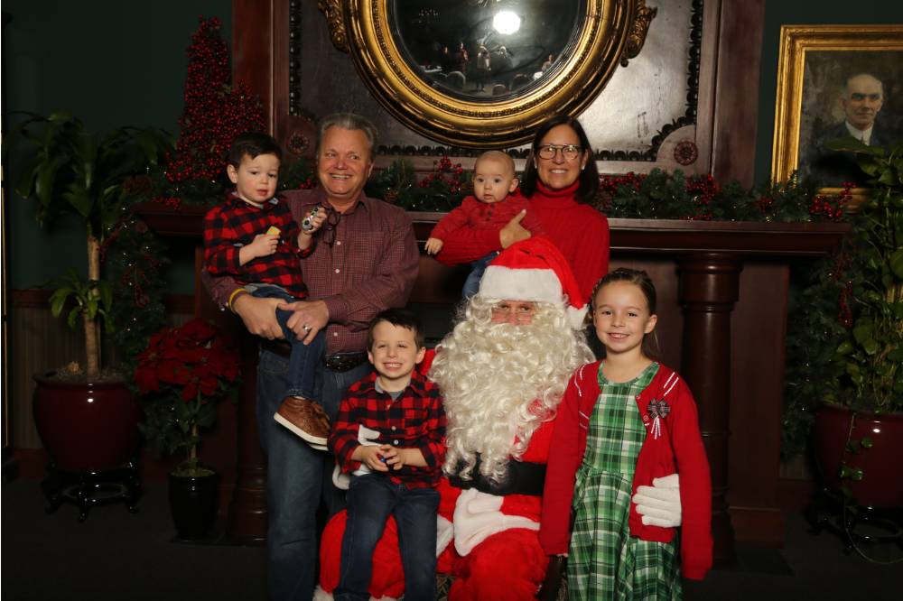 Family of six with Santa Claus